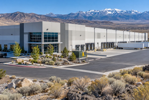 Modern Warehouse Against Snowy Mountains